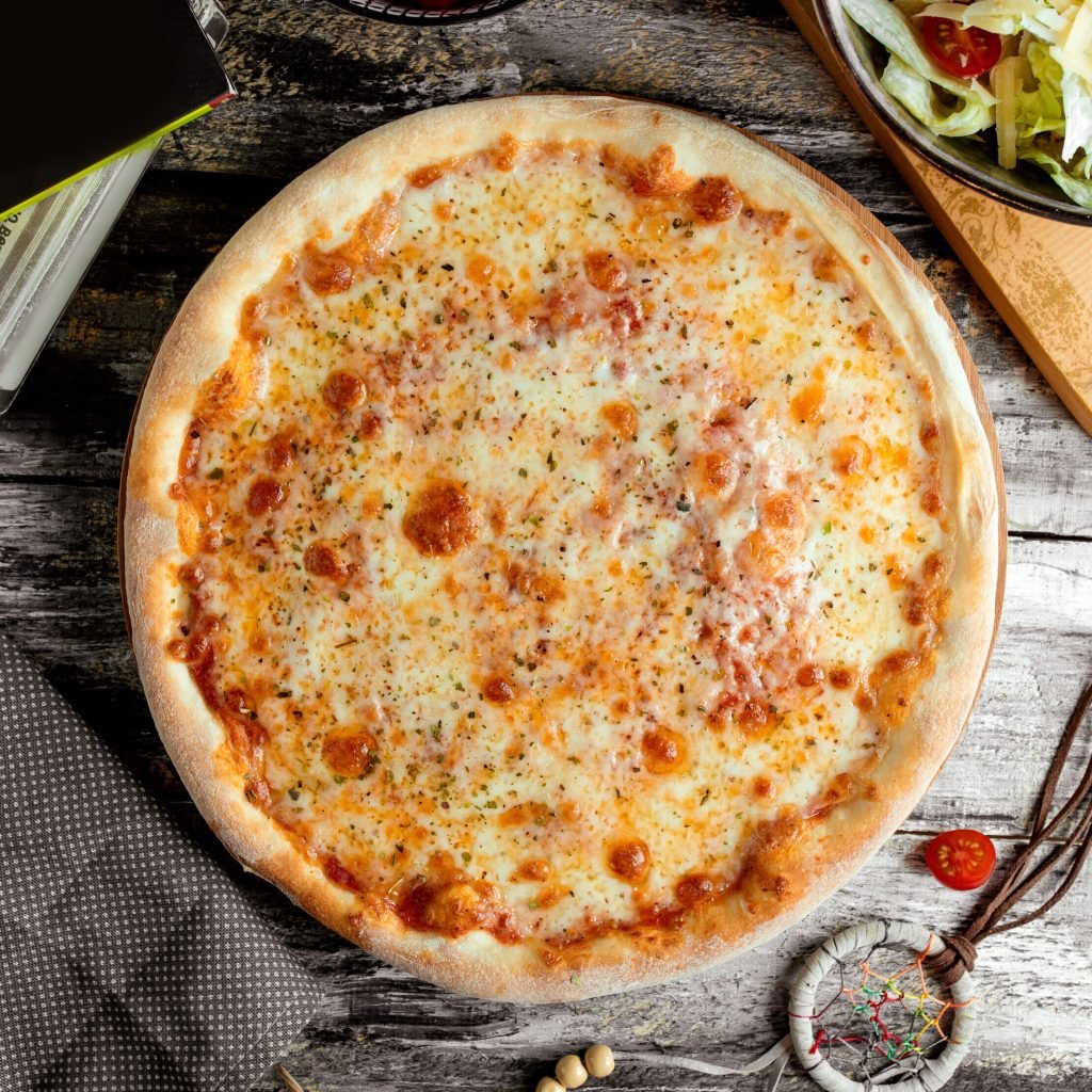 margarita pizza on the table